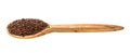 Wooden spoon with canihua grains isolated