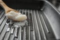 Wooden spoon with coconut oil in frying pan Royalty Free Stock Photo