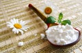 Wooden spoon with cottage cheese