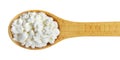Wooden spoon of cottage cheese isolated on white background, top view Royalty Free Stock Photo