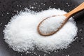 Wooden spoon with crystalline fructose close up