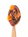 Wooden spoon with dates, dried apricots, raisins isolated on white background. Dried fruits. Royalty Free Stock Photo