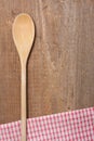 Wooden spoon and dish towel