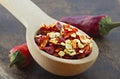 Wooden spoon with dried crushed chili red pepper Royalty Free Stock Photo