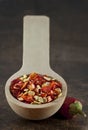 Wooden spoon with dried crushed chili red pepper Royalty Free Stock Photo