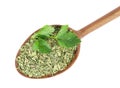 Wooden spoon with dried parsley and fresh twig on background, top view Royalty Free Stock Photo