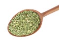 Wooden spoon with dried parsley on white, top view Royalty Free Stock Photo