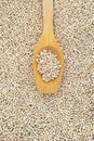 Wooden spoon and dried pearled barley Royalty Free Stock Photo