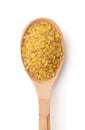 Wooden spoon of dry bulgur Royalty Free Stock Photo