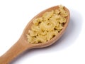 Wooden spoon with dry pastas Royalty Free Stock Photo