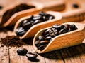 A wooden spoon filled with coffee beans and a pile of coffee grounds Royalty Free Stock Photo