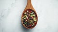 Wooden spoon filled with spices Royalty Free Stock Photo