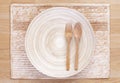 Wooden spoon and fork and empty wooden dish