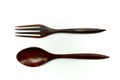 Wooden spoon and fork made from red paduak on white background Royalty Free Stock Photo
