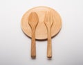 Wooden spoon and fork on wooden dish Royalty Free Stock Photo