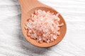 A wooden spoon full of Himalayan coarse salt close up Royalty Free Stock Photo