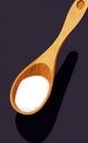 Wooden spoon full of salt