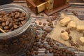 Wooden spoon in a glass jar with coffee beans, coffee grinder, pieces of brown sugar on a wooden background. Close up Royalty Free Stock Photo