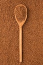 Wooden spoon with granulated coffee Royalty Free Stock Photo
