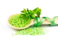 Wooden spoon with green bath salt Royalty Free Stock Photo