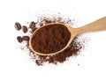 Wooden spoon of ground coffee and beans on white background, top view Royalty Free Stock Photo