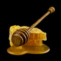 Wooden spoon with honey isolated on black background Royalty Free Stock Photo