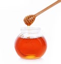 Wooden Spoon honey, honey jar on white background Royalty Free Stock Photo