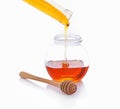 Wooden Spoon honey, honey jar on white background Royalty Free Stock Photo