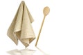 Wooden spoon and kitchen towel