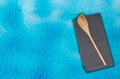Wooden spoon and kitchen towel on turquoise krakelee Royalty Free Stock Photo