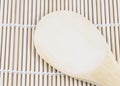 Wooden spoon on the making sushi bamboo mat Royalty Free Stock Photo