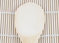 Wooden spoon on the making sushi bamboo mat Royalty Free Stock Photo
