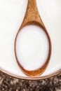 Wooden spoon with milk