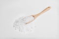 Wooden spoon with natural sea salt on white Royalty Free Stock Photo