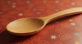 Wooden spoon on a patterned surface featuring swirls and star shapes. The spoon has Royalty Free Stock Photo