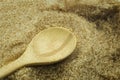 Wooden spoon on pile brown cane sugar texture background. Raw natural, Organic Royalty Free Stock Photo