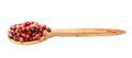 Wooden spoon with pink peppercorns isolated Royalty Free Stock Photo