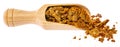 a wooden spoon of propolis granules