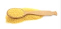 Wooden spoon with raw couscous on white background