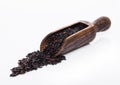 Wooden spoon of raw organic black venus rice on white background.Healthy food Royalty Free Stock Photo
