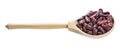 Wooden spoon with red spotted pinto beans isolated