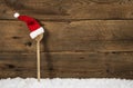 Wooden spoon with santa hat: rustic christmas background Royalty Free Stock Photo