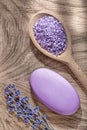 Wooden spoon sea salt bunch dry lavender bar of soap on wood board spa treatment concept Royalty Free Stock Photo