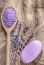 Wooden spoon sea salt dry lavender bar of soap on wood board top Royalty Free Stock Photo