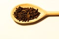 Wooden spoon with seeds cloves