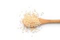 Wooden spoon with sesame seeds on white background, top view Royalty Free Stock Photo