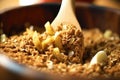 wooden spoon stirring apple crisp mixture