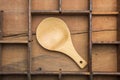 Wooden spoon on typeset tray. Royalty Free Stock Photo