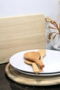 Wooden spoon with utensil and wooden cutting board in kitchen ro