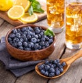 Wooden Spoonful and Bowl of Fresh Blueberries Royalty Free Stock Photo